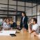 Group of people working out business plan in an office