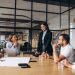 Group of people working out business plan in an office